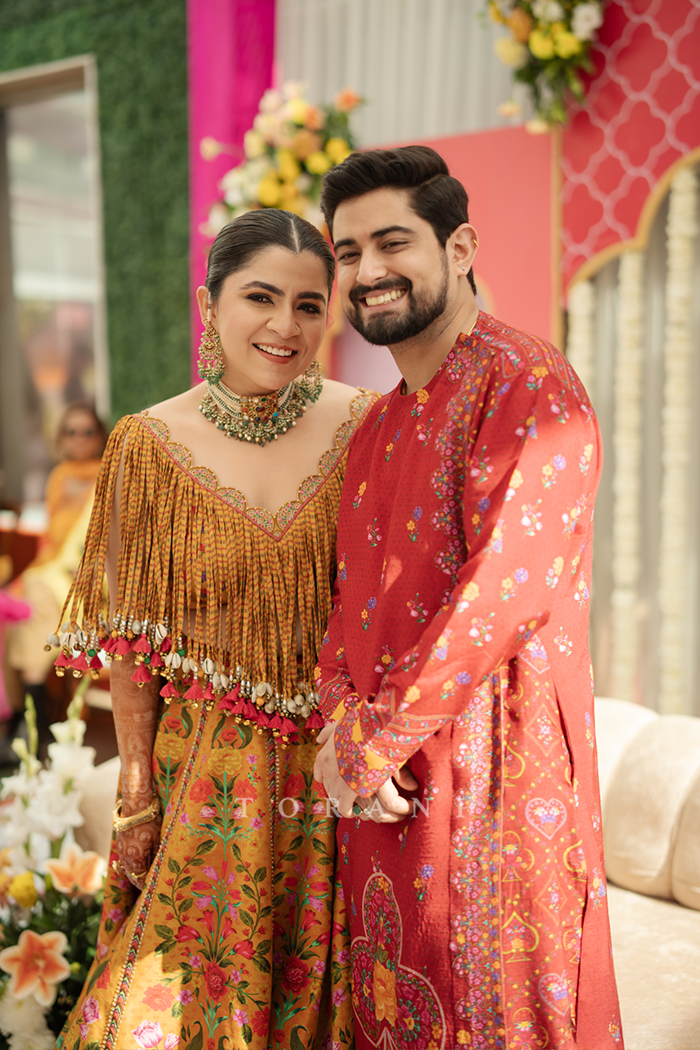Aakrati and Vaibhav in our Dil Seher Bhavi Lehenga Set & Dil Surkh Mamun Kurta Set