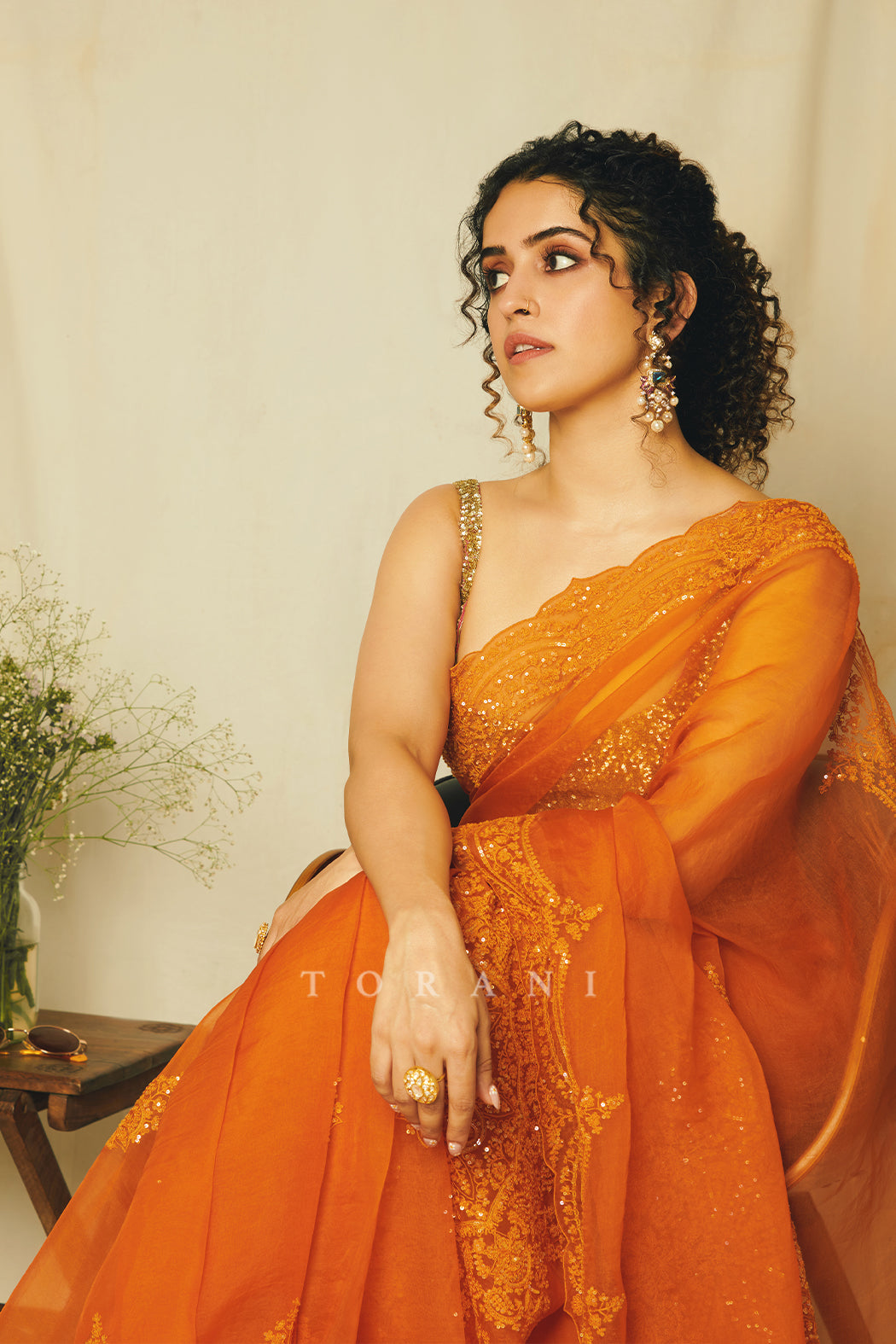 SANYA MALHOTRA WEARING ORANGE ORGANZA SAREE FROM TORANI DESIGNER