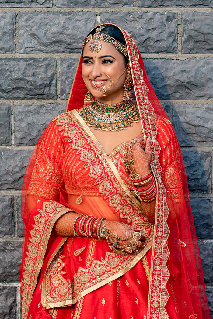 VASUDHA ROY's weddign photos IN Red bridal lehenga by Torani