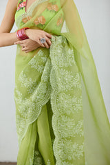 Embroidered green organza saree by Torani