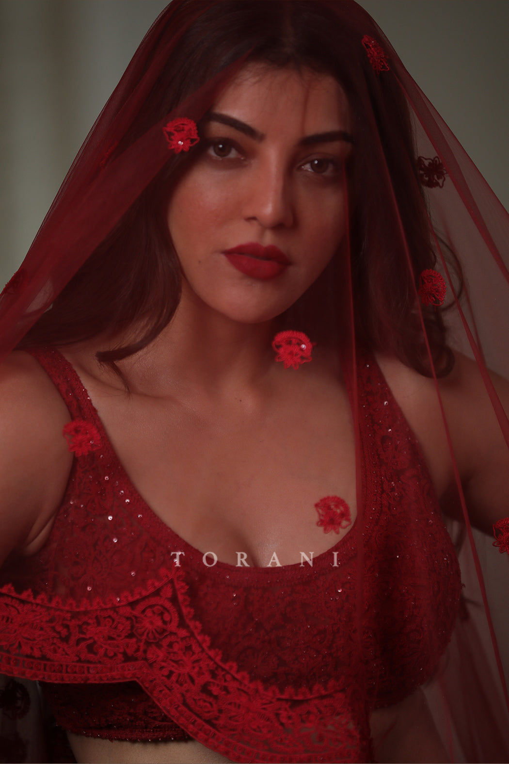 Kajal Aggarwal Kitchlu in our Surkh Mrinal Lehenga Set