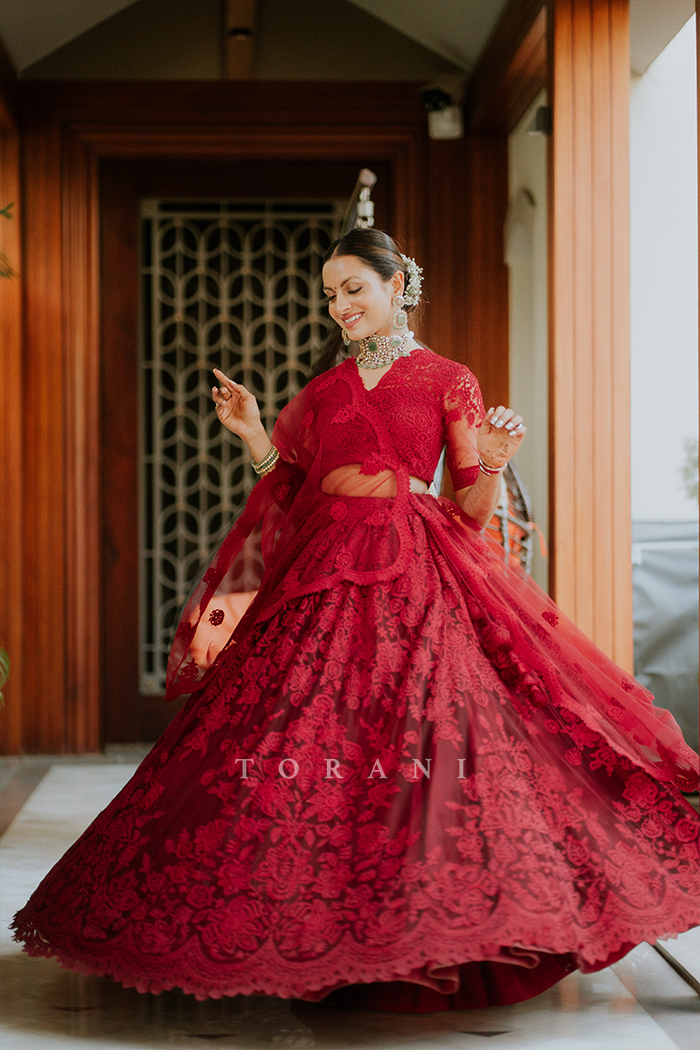 Kajol in Red bridal lehenga set by Torani