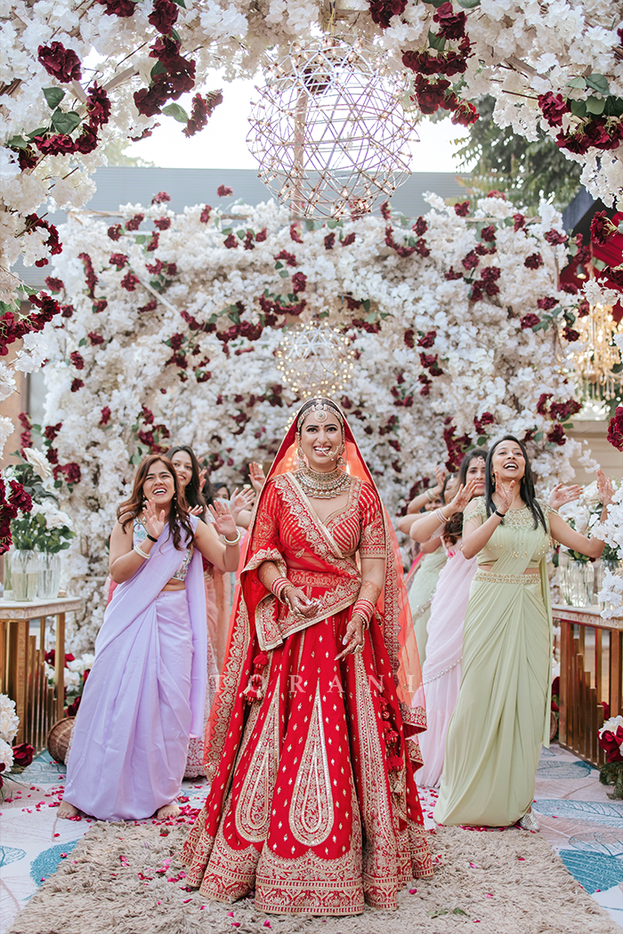 Vasudha roy in her wedding wearing red Lehenga by Torani designer