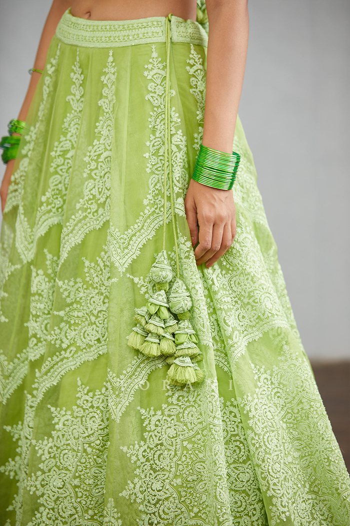 Fully embroidered green lehenga set with tessels