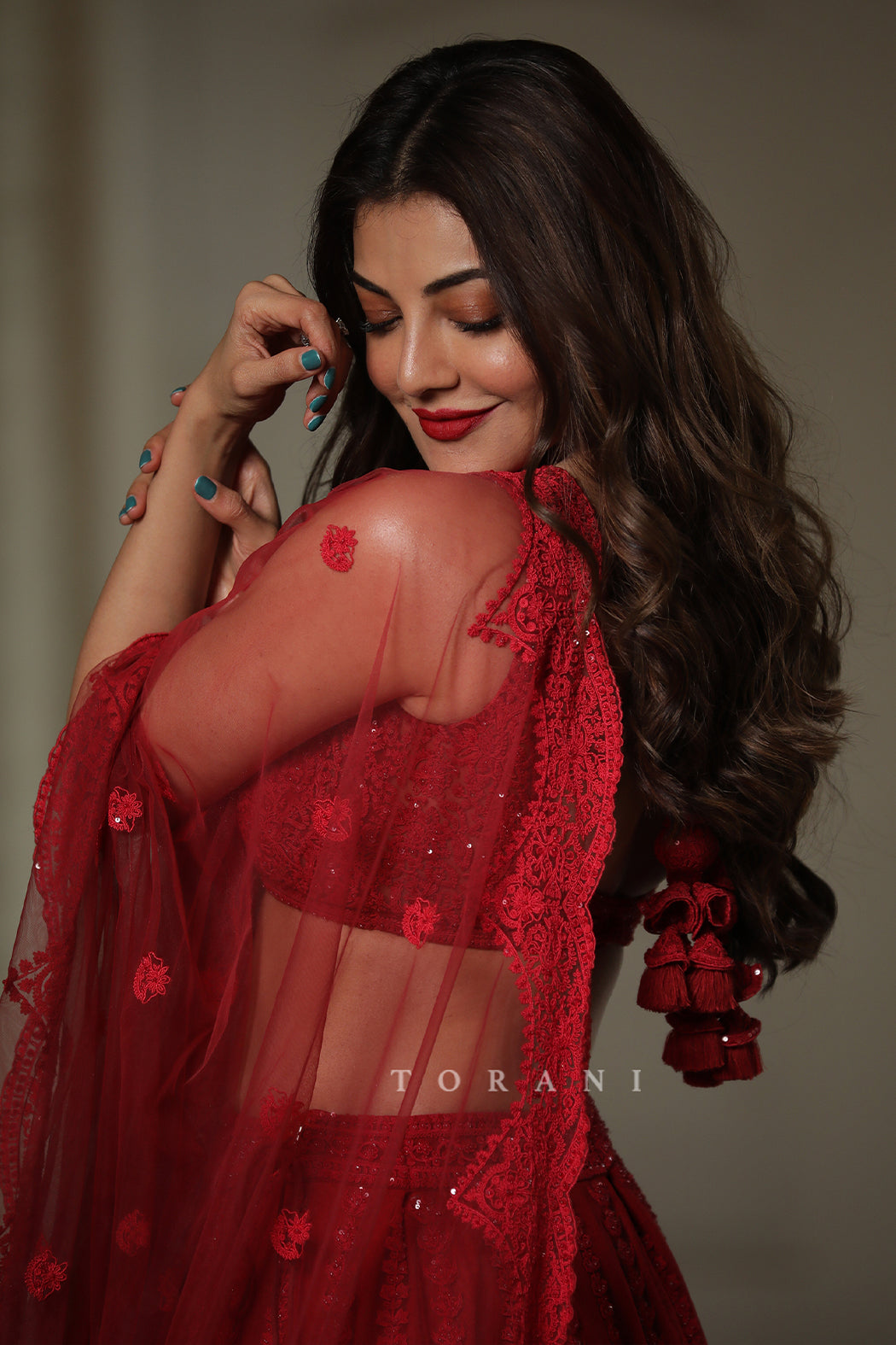 Kajal Aggarwal Kitchlu in our Surkh Mrinal Lehenga Set