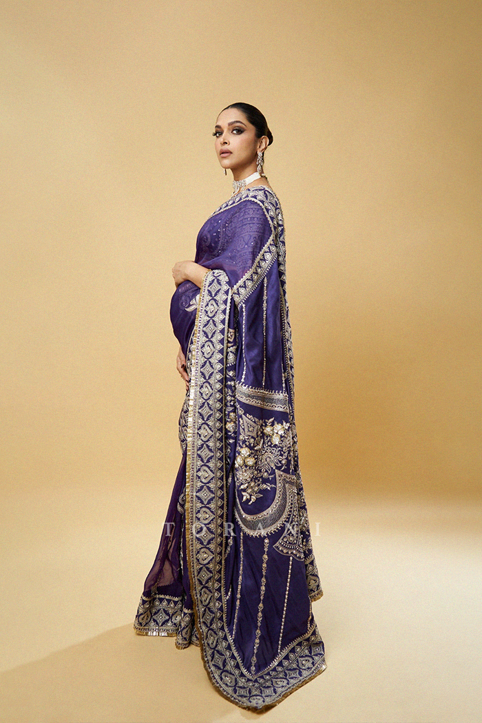 deepika padukone purple dress Image may contain: one or more people