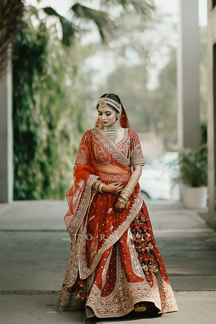 Sruthi with Her Partner in Our Custom Sindoori Suhani Lehenga Set &amp; Mogra Gaurish Sherwani Set