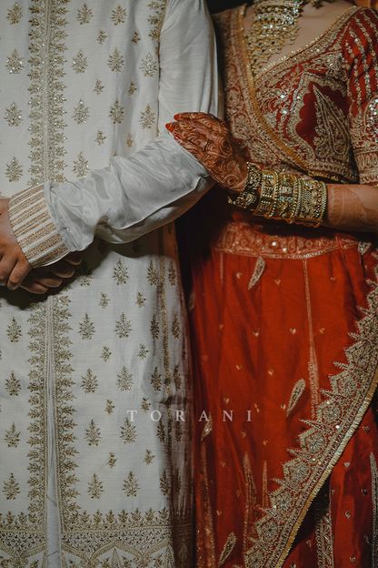 Sruthi with Her Partner in Our Custom Sindoori Suhani Lehenga Set &amp; Mogra Gaurish Sherwani Set