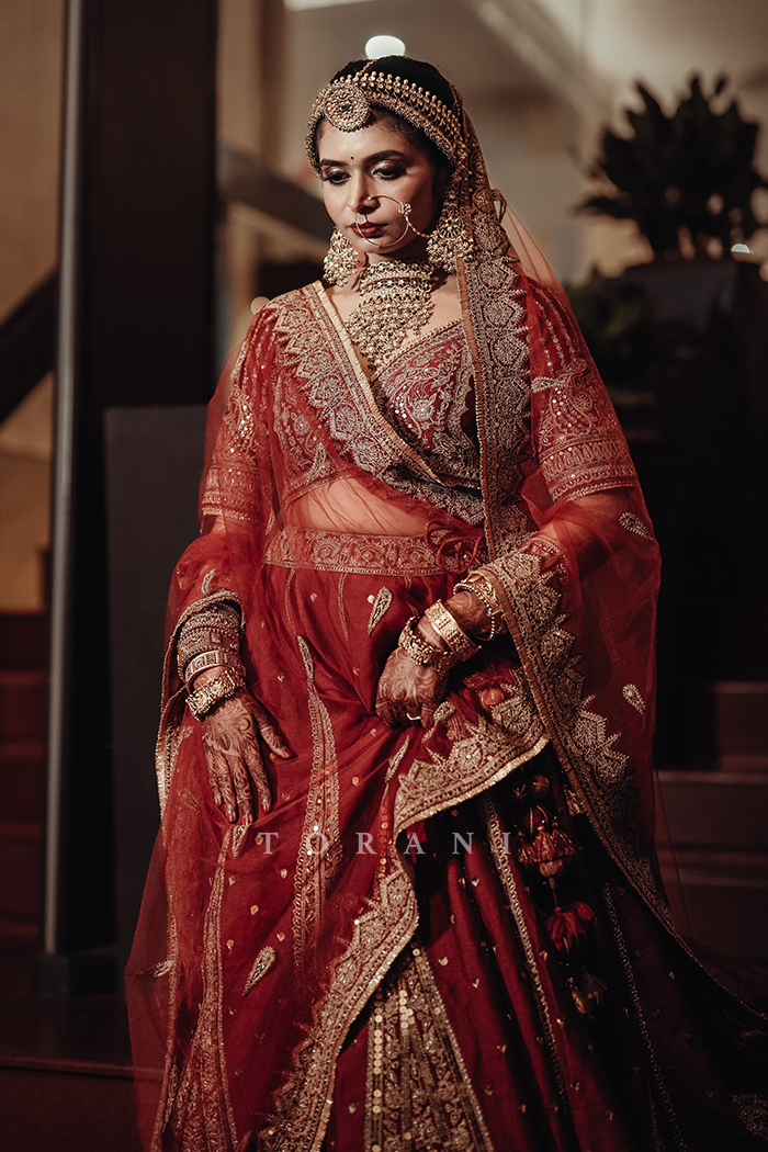 Sruthi with Her Partner in Our Custom Sindoori Suhani Lehenga Set &amp; Mogra Gaurish Sherwani Set