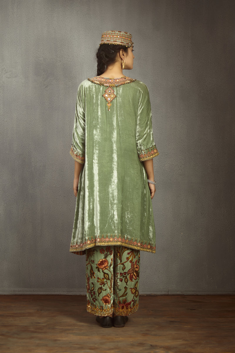 Solid green kurta set in velvet with printed pants